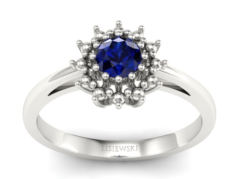 Złoty pierścionek z szafirem białe złoto - P15097Bsz