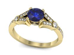Złoty pierścionek z szafirem i diamentami złoto - P15304zszc