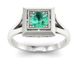 Pierścionek ze szmaragdem w oprawie z białego złota - p16147bsm