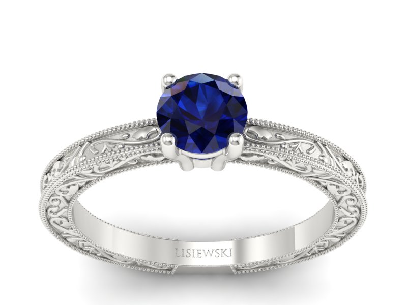 Złoty pierścionek z szafirem białe złoto - p16277bsz