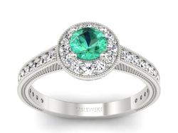 Złoty pierścionek ze szmaragdem i brylantami - p16629bsm